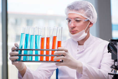 Man working in the chemical lab on science project