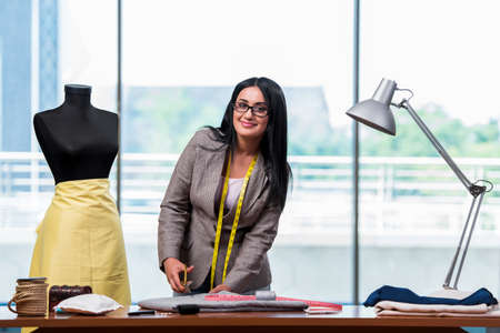 Woman tailor working on new clothing