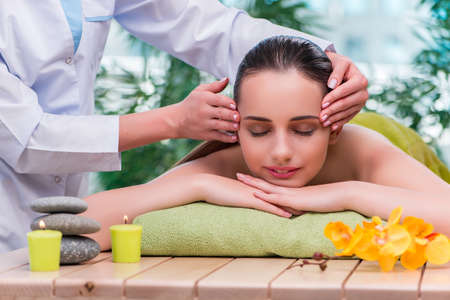 Young woman during massage sessionの写真素材