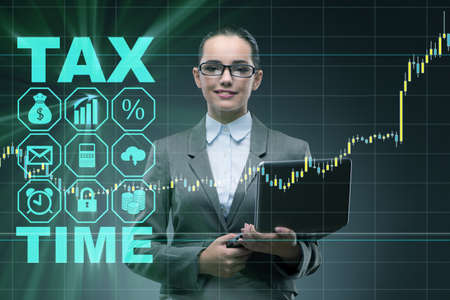 Businesswoman in business tax conceptの写真素材