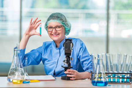 Experienced lab assistant working on chemical solutionsの写真素材