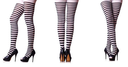 Legs with striped stockings isolated on whiteの写真素材