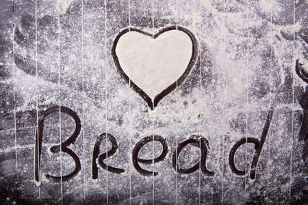 Cook preparing dough for baking in the kitchenの写真素材