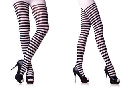 Legs with striped stockings isolated on whiteの写真素材