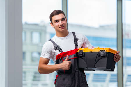 Young carpenter working at construction siteの写真素材