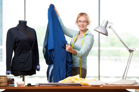 Woman tailor working on new clothingの写真素材
