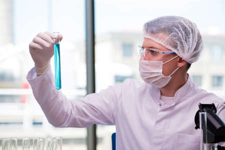 Man working in the chemical lab on science project