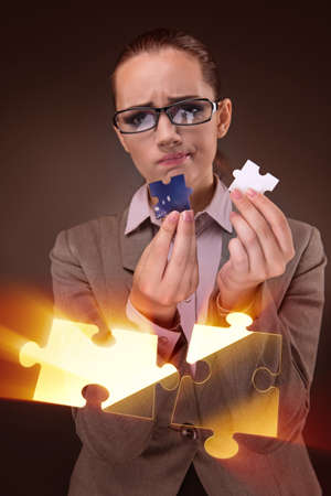Businesswoman in business concept with puzzle piece