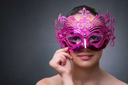 Young woman with carnival maskの写真素材