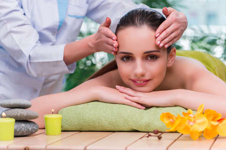 Young woman during massage sessionの写真素材