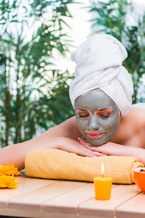 Young woman in spa health concept