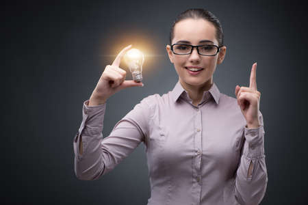 Young businesswoman in bright idea conceptの写真素材