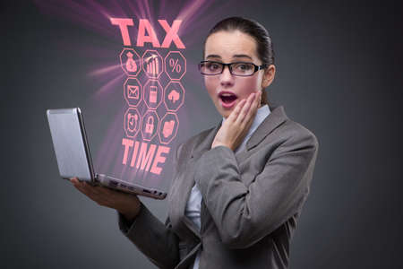 Businesswoman in business tax conceptの写真素材