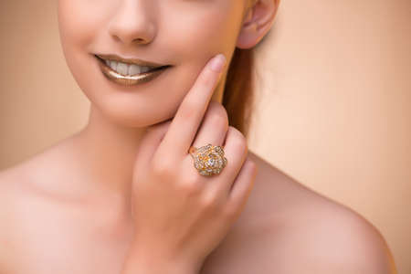 Nice woman wearing elegant jewelleryの写真素材