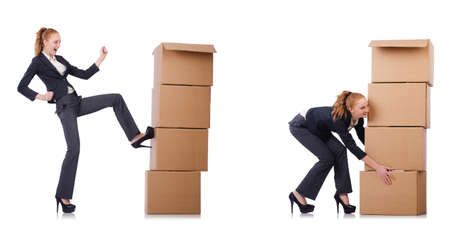 Businesswoman with boxes isolated on whiteの写真素材