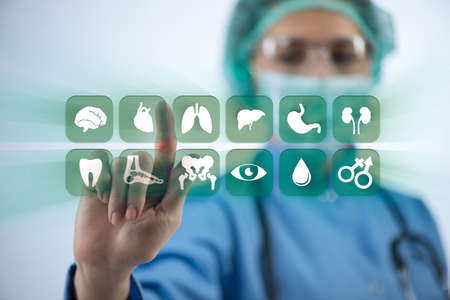 Woman doctor pressing buttons with various medical icons