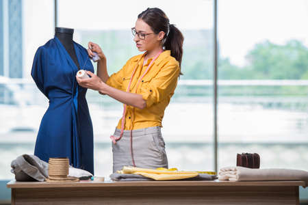 Woman tailor working on new clothingの写真素材