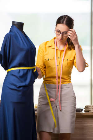Woman tailor working on new clothingの写真素材