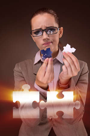 Businesswoman in business concept with puzzle pieceの写真素材