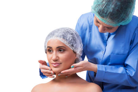 Young woman preparing for plastic surgery isolated on white