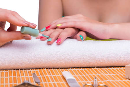 Woman in hand treatment manicure concept