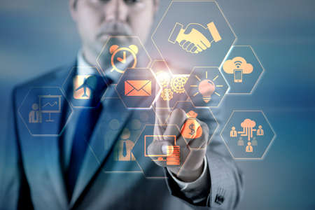 Businessman pressing virtual buttons in business concept