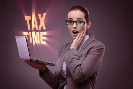 Businesswoman in business tax conceptの写真素材