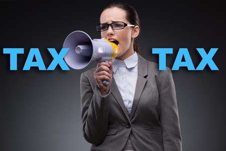 Businesswoman in business tax conceptの写真素材