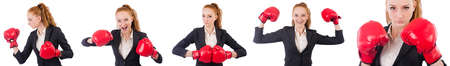 Woman businesswoman with boxing gloves on whiteの写真素材