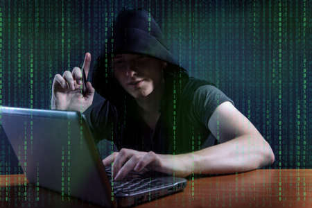 Young hacker in digital security concept