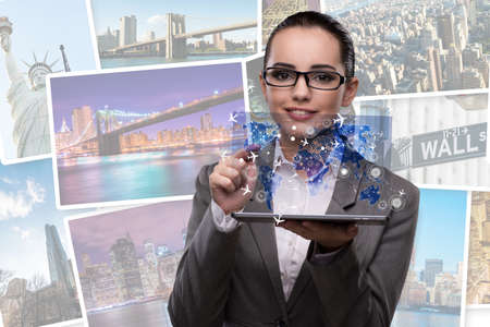 Young businesswoman in online travel booking conceptの写真素材