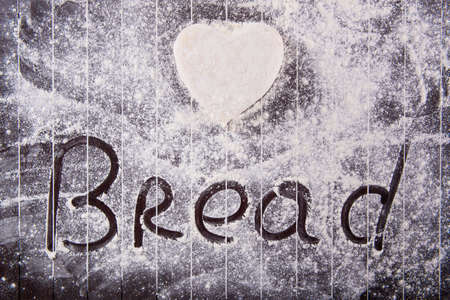 Cook preparing dough for baking in the kitchenの写真素材