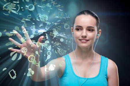 Young girl in sports concept pressing virtual buttons