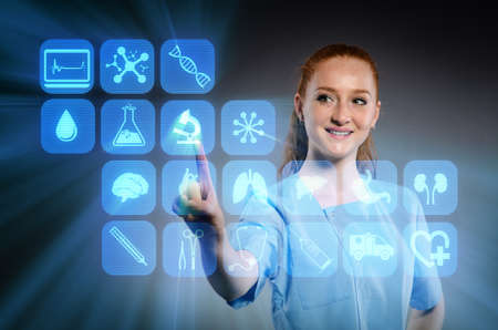 Woman doctor pressing buttons with various medical icons