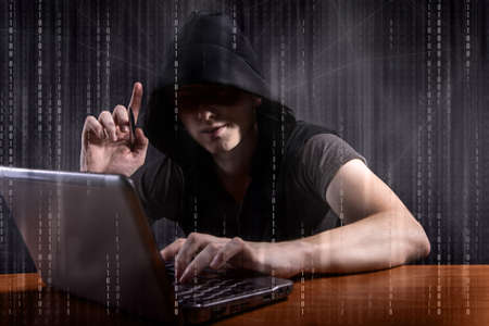 Young hacker in digital security concept
