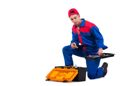 Young repairman with wrench spanner isolated on whiteの写真素材