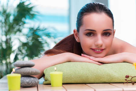 Young beautiful woman during spa procedureの写真素材