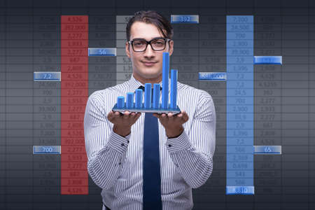 Young businessman in online trading conceptの写真素材