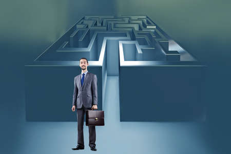 Businessman with maze in difficult situations conceptの写真素材