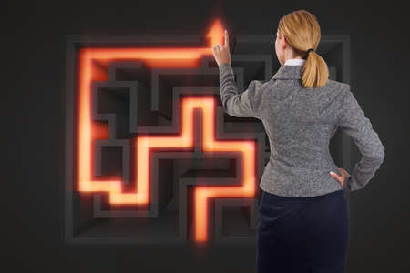 Businesswoman with maze in difficult situations conceptの写真素材