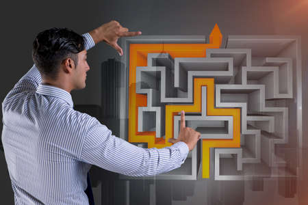 Businessman with maze in difficult situations conceptの写真素材