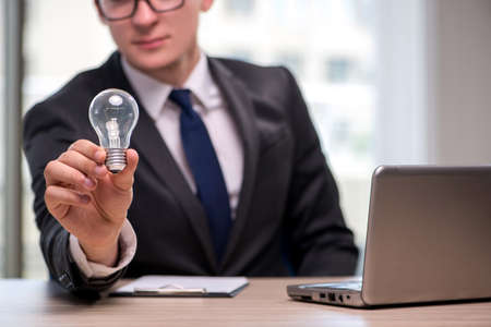 Businessman with light bulb in idea conceptの写真素材