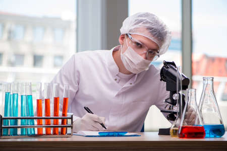Young chemist working in the lab