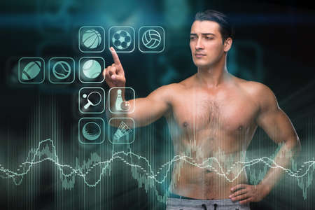 Young muscular man in sports conceptの写真素材