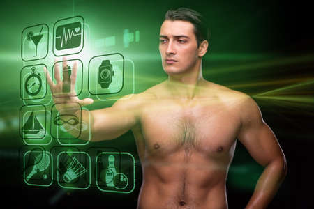 Young muscular man in sports conceptの写真素材