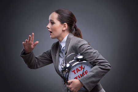 Businessman in late taxes payment conceptの写真素材