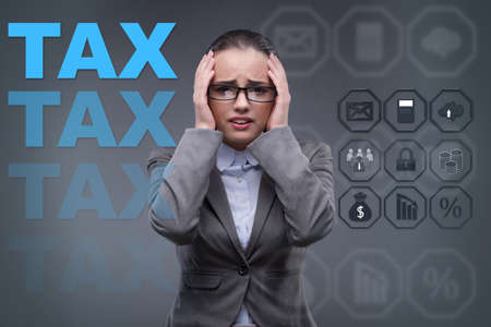 Businesswoman in business tax conceptの写真素材