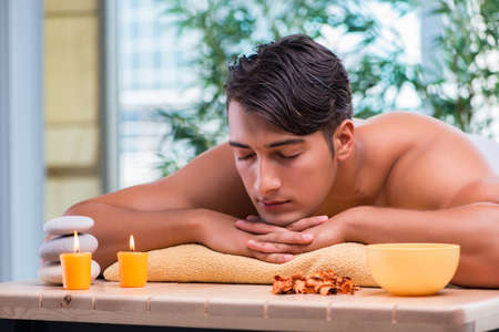 Handsome man during spa sessionの写真素材