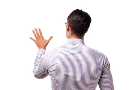 Young handsome businessman pressing buttons isolated on whiteの写真素材