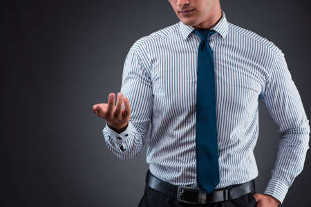 Handsome businessman pressing virtual buttonsの写真素材